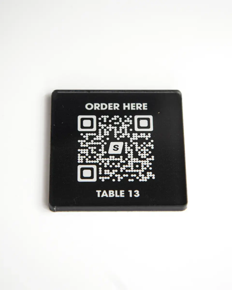 Small black Perspex square with a QR code and 'Order here'