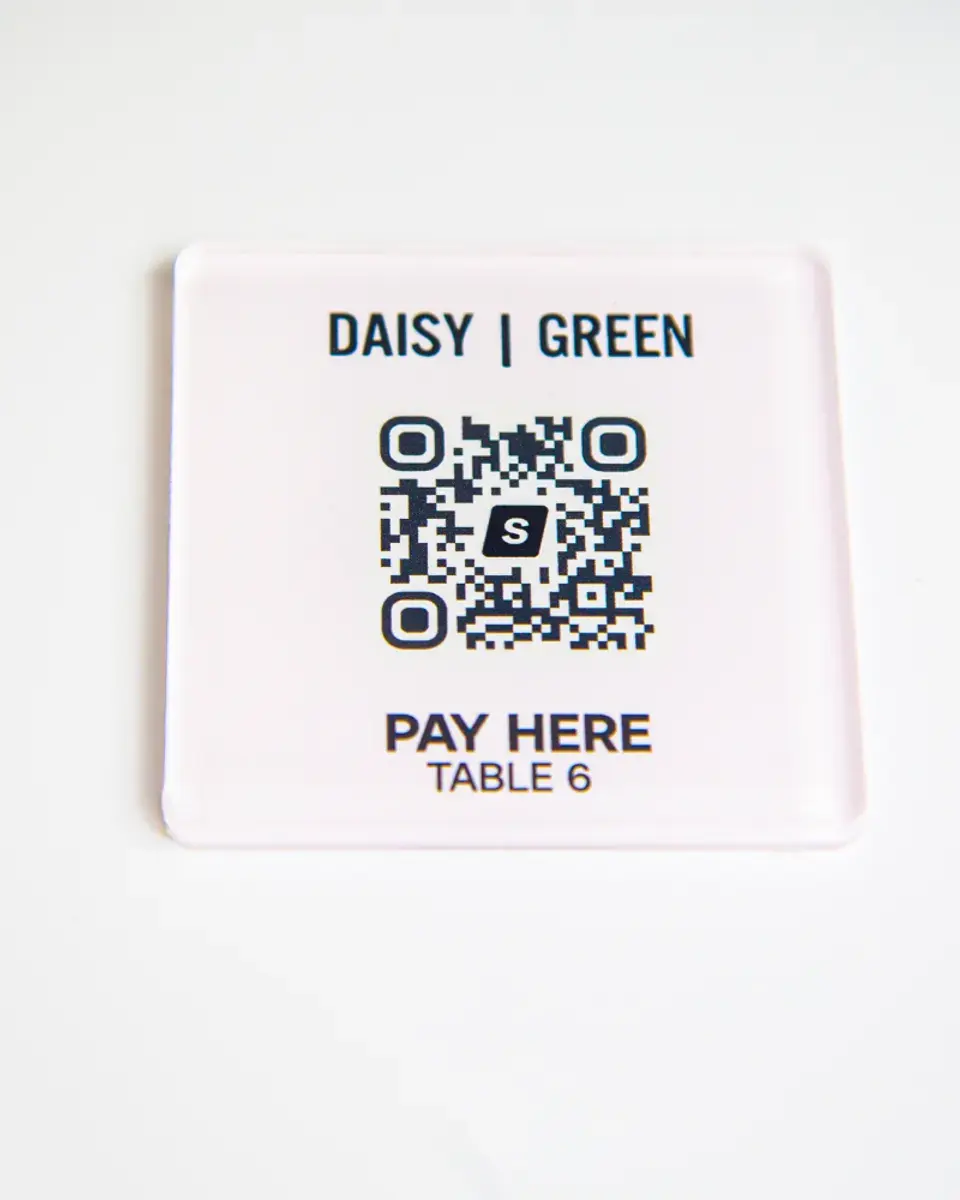 White Perspex square for Daisy Green with a QR code to pay