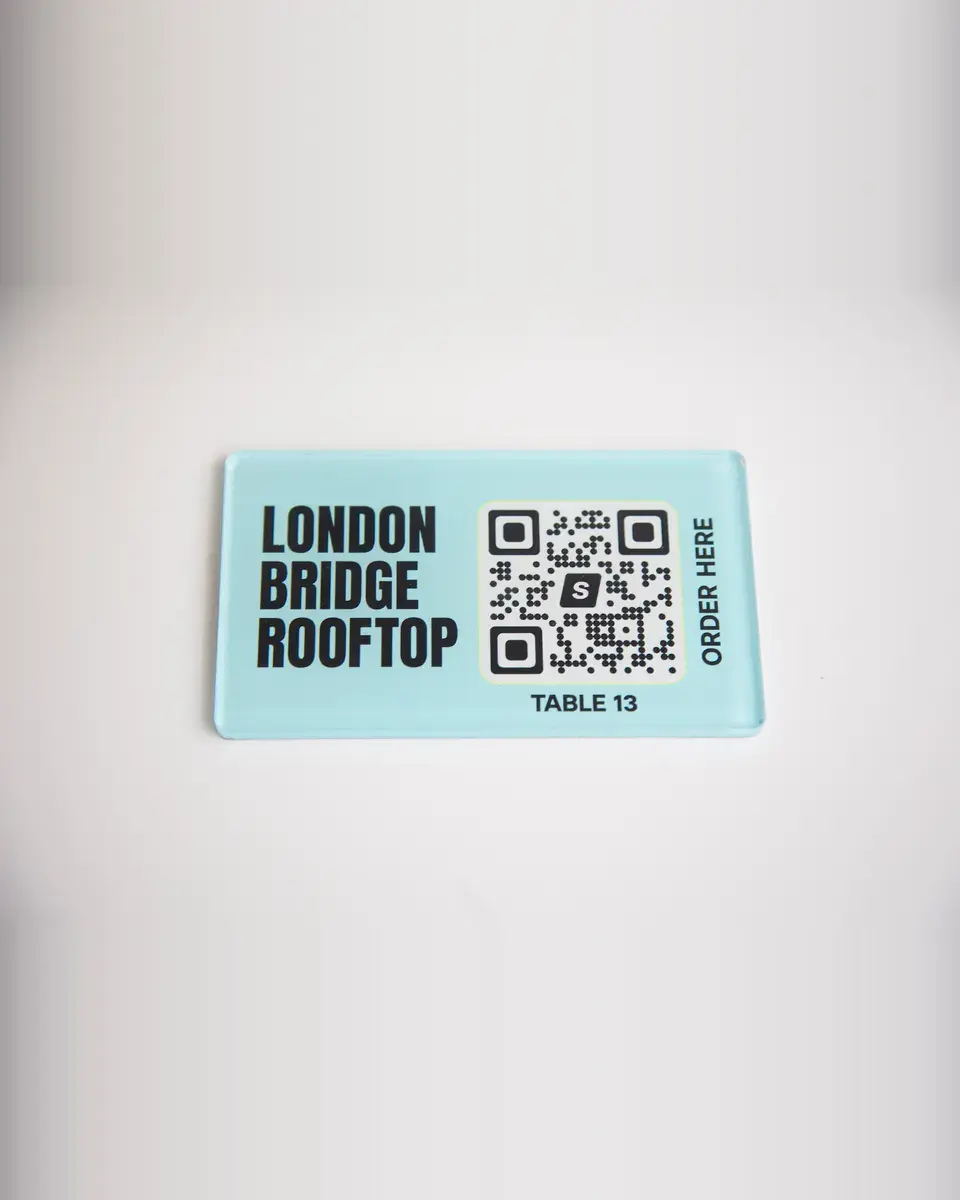 Pale blue Perspex rectangle for London Bridge Rooftop with a QR code to order