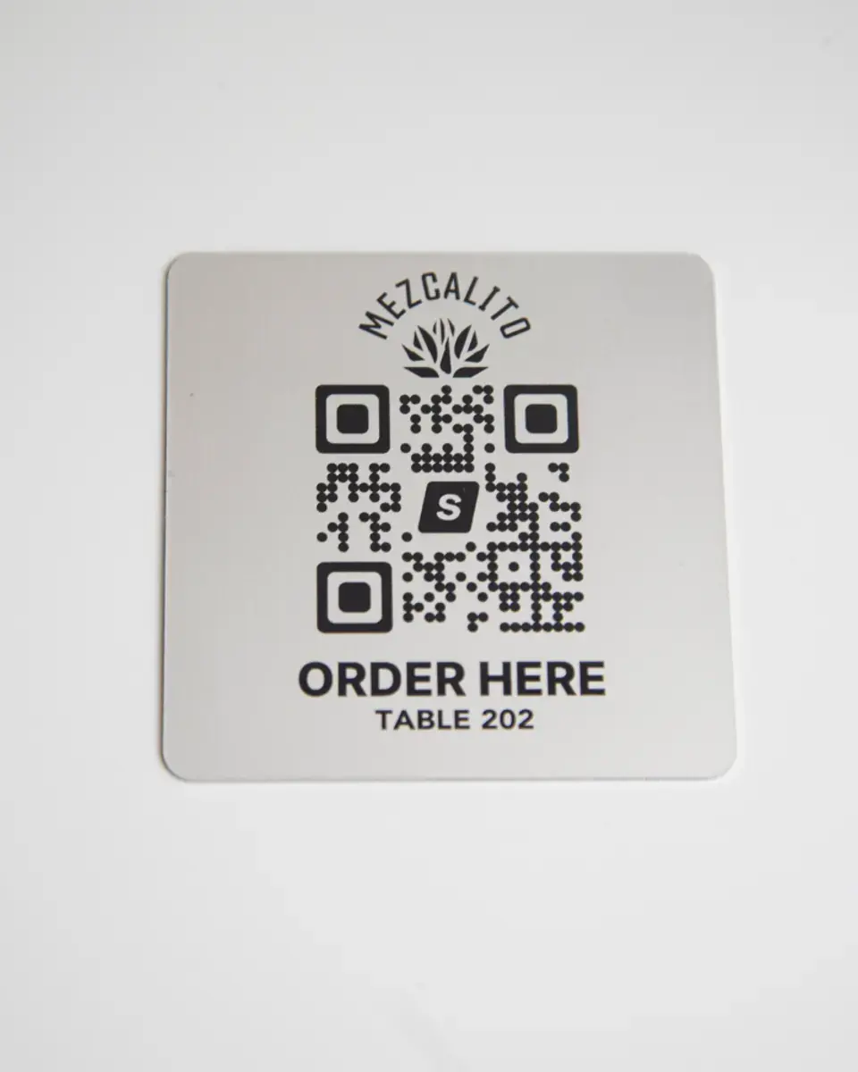 Brushed silver aluminium square with a QR code and 'Order here'